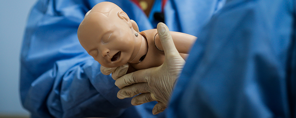 Simulation of physicians delivering baby