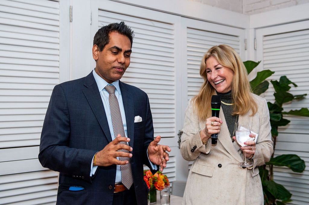 Rahul Sharma, M.D., and Jessica Bibliowicz share a toast