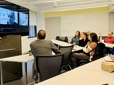 Doctors looking at a patient on a screen