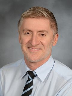 Dr. Adam Vella